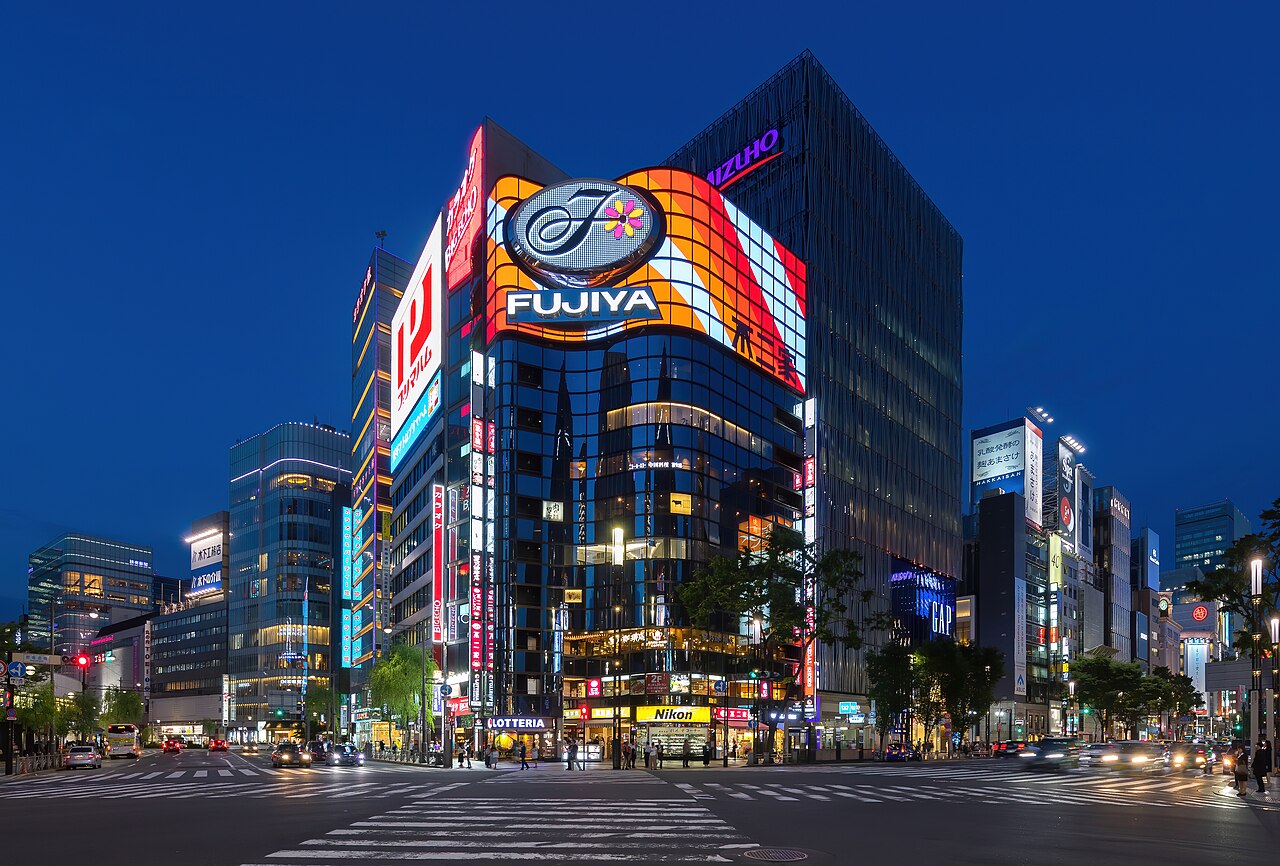 An illuminated Ginza street corner at blue hour